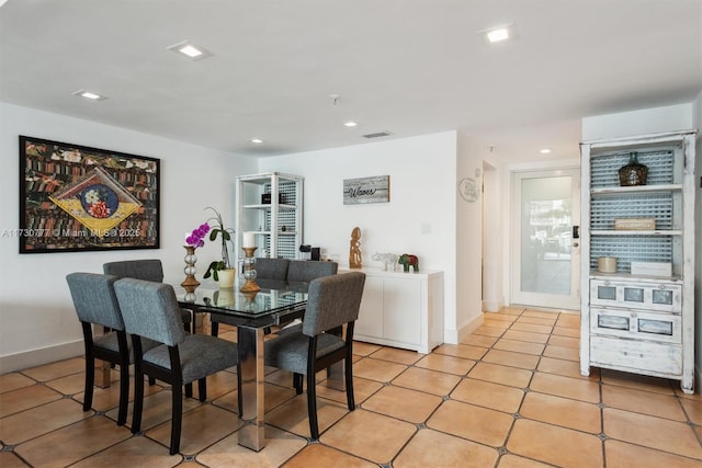 dining area with light tile patterned flooring