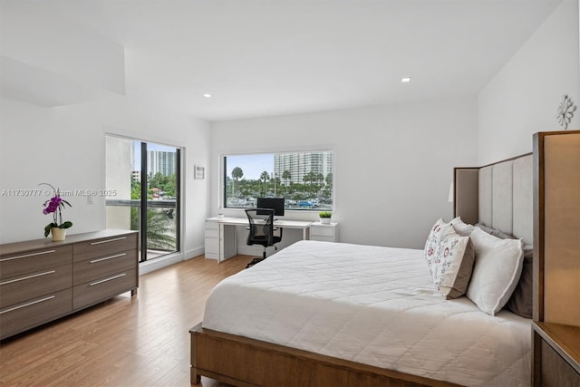 bedroom featuring access to outside and light hardwood / wood-style flooring