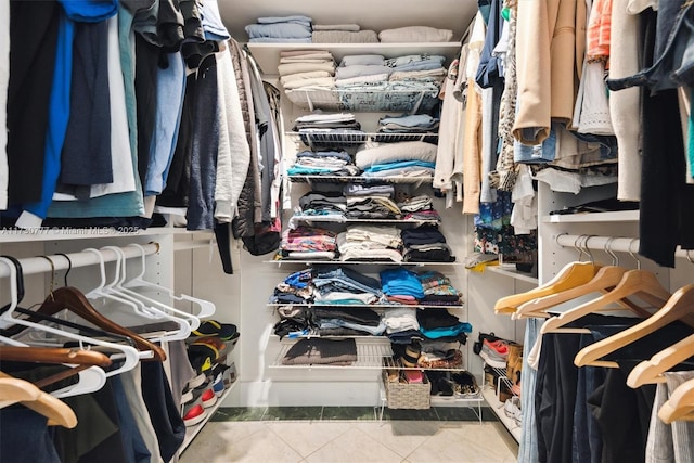 spacious closet featuring tile patterned flooring