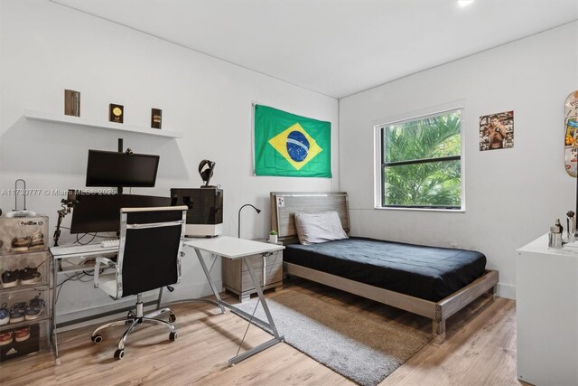 bedroom featuring hardwood / wood-style flooring