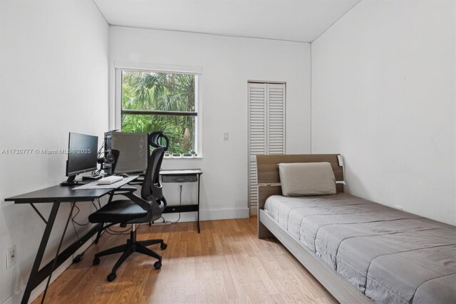 bedroom with light wood-type flooring