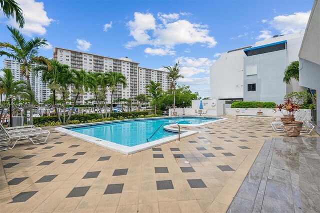 view of swimming pool featuring a patio area