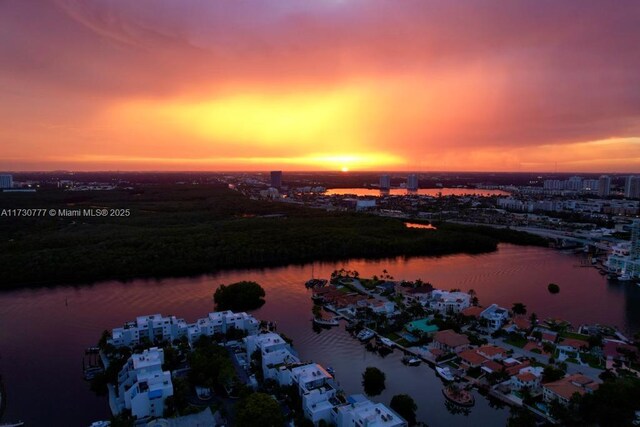 aerial view at dusk with a water view