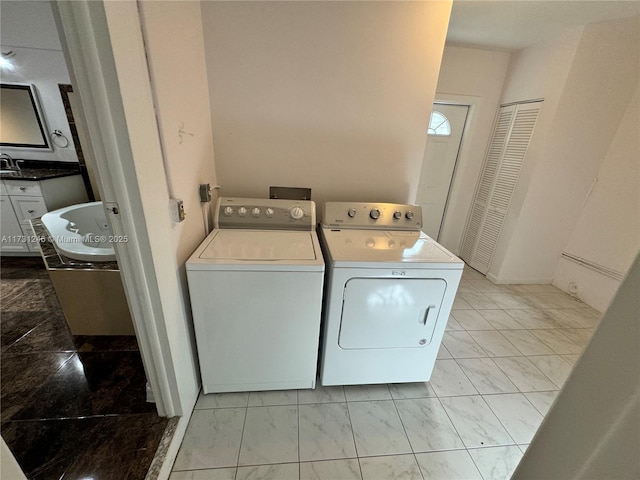 laundry room featuring washing machine and dryer