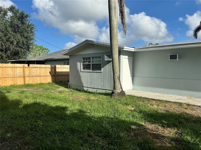 rear view of house with a lawn