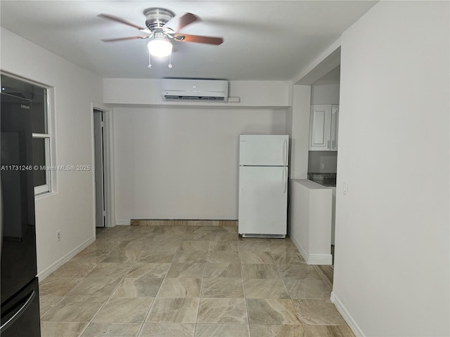 unfurnished room with a wall unit AC and ceiling fan