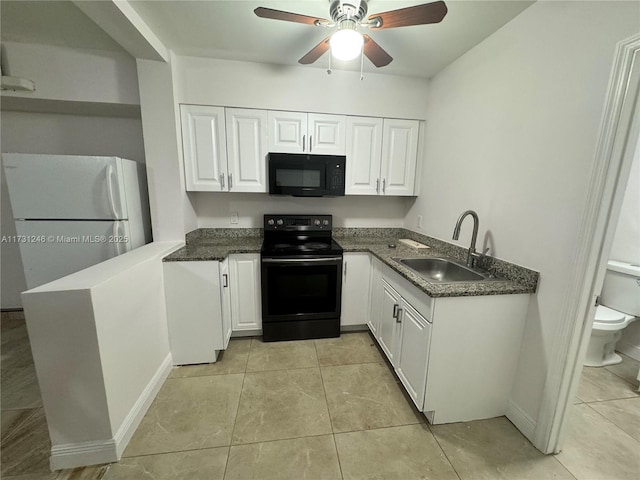 kitchen with sink, black appliances, and white cabinets