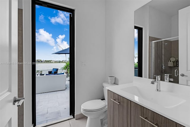 bathroom with walk in shower, a wealth of natural light, tile patterned floors, and toilet