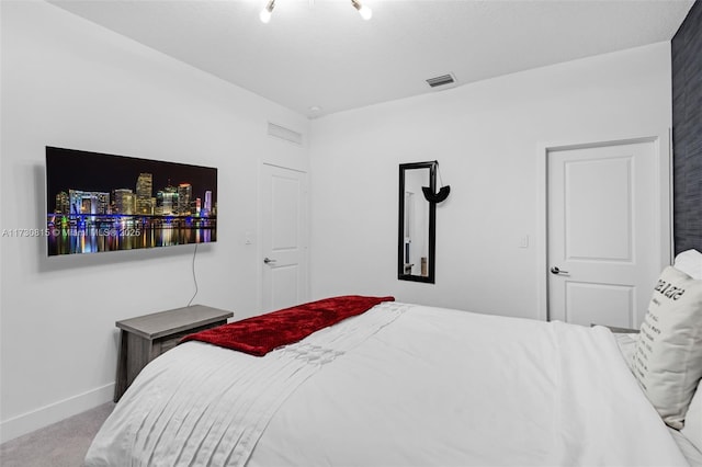 bedroom featuring light carpet