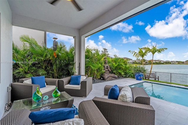 view of patio with a fenced in pool, an outdoor hangout area, and a water view