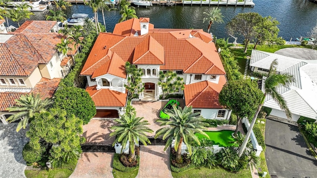 birds eye view of property featuring a water view