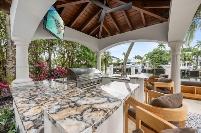 view of patio / terrace with ceiling fan, a gazebo, a water view, a grill, and area for grilling