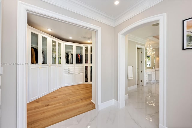 hallway featuring crown molding