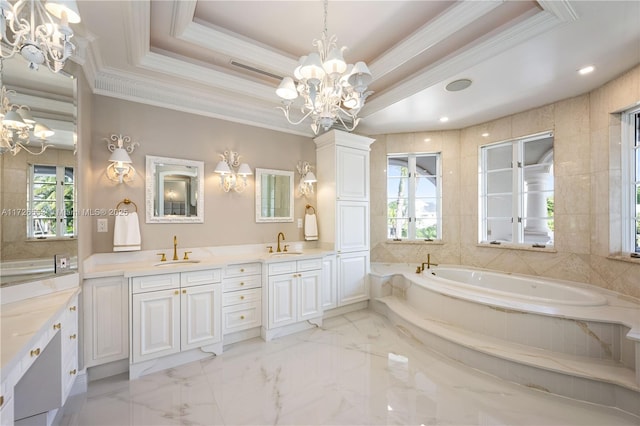 bathroom featuring a raised ceiling, crown molding, plenty of natural light, and a notable chandelier