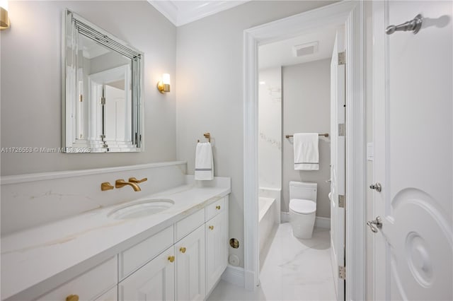 bathroom featuring crown molding, vanity, and toilet