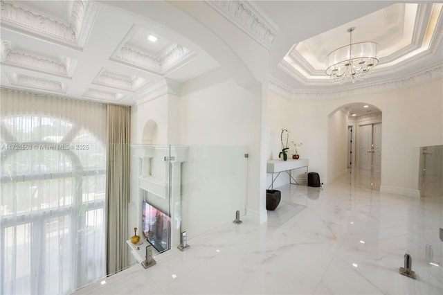 corridor with coffered ceiling, crown molding, beamed ceiling, and a chandelier