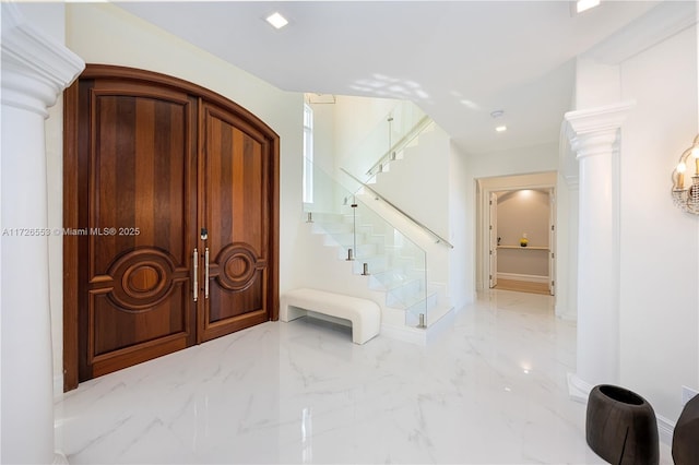 entryway featuring ornate columns