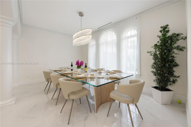 dining space featuring crown molding and ornate columns