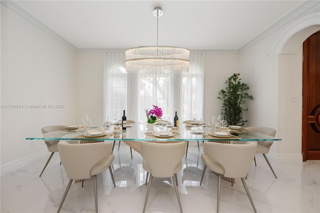 dining space featuring an inviting chandelier and crown molding