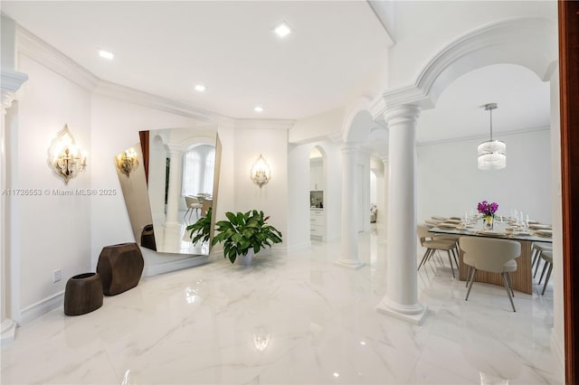 interior space with ornate columns and ornamental molding