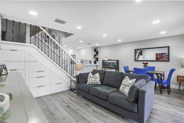 living room with light hardwood / wood-style floors