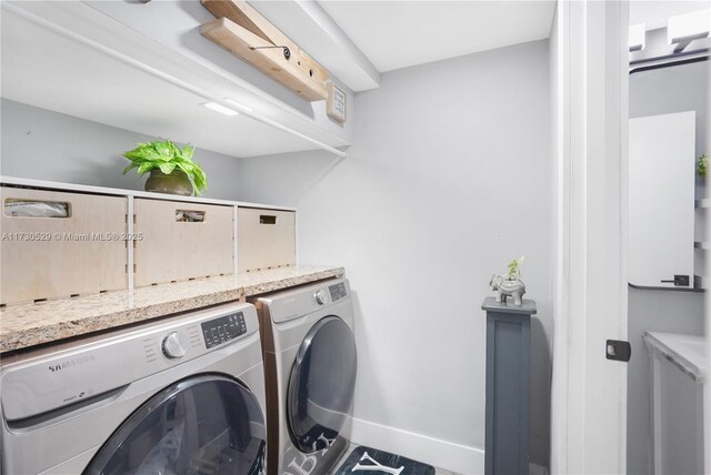 washroom with separate washer and dryer