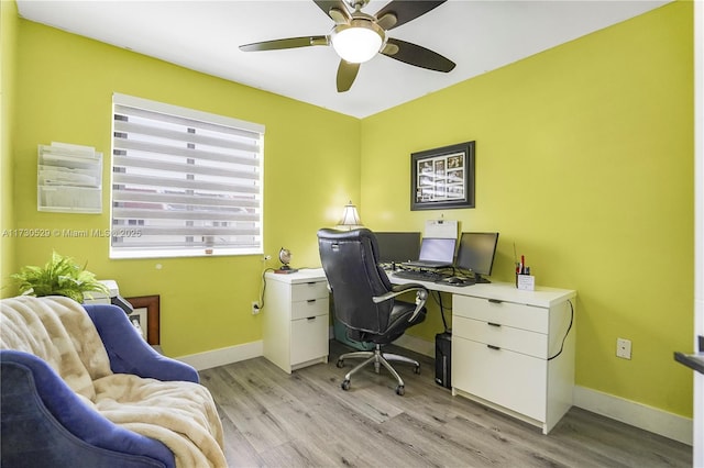 office with ceiling fan and light hardwood / wood-style floors