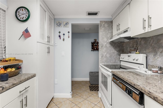 kitchen with white cabinetry, ornamental molding, light tile patterned floors, light stone counters, and white appliances