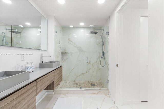 bathroom with vanity and an enclosed shower