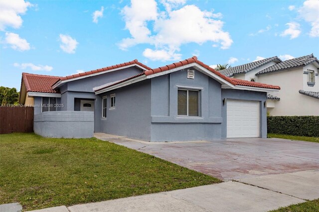 view of home's exterior featuring a garage and a lawn