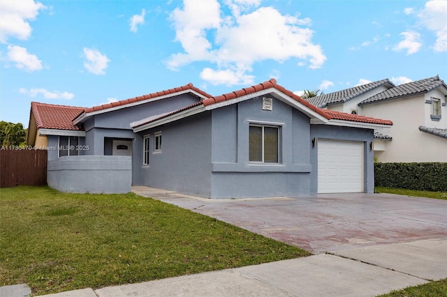 view of side of home with a garage and a lawn