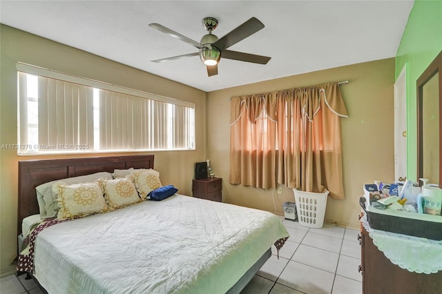 bedroom with light tile patterned flooring and ceiling fan