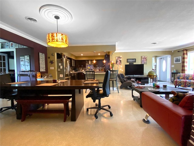 dining area with ornamental molding