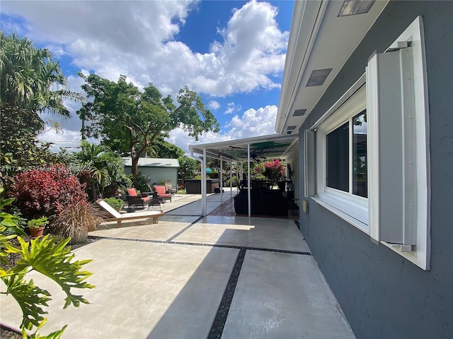 view of patio / terrace featuring a jacuzzi