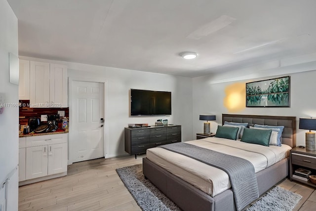 bedroom featuring light wood-type flooring