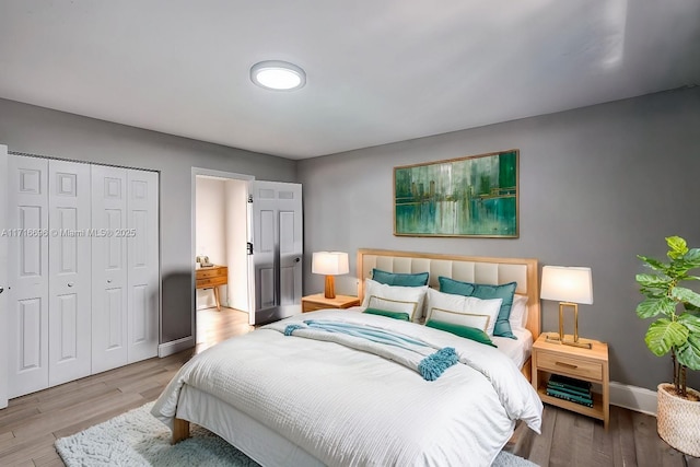 bedroom with a closet and light wood-type flooring