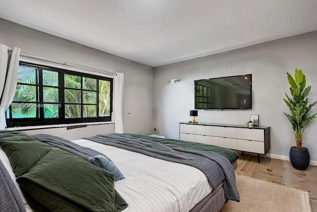 bedroom with light hardwood / wood-style flooring