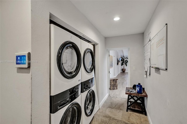 laundry room featuring stacked washer and dryer