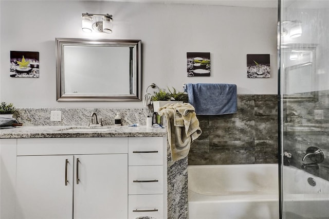 bathroom featuring vanity and  shower combination