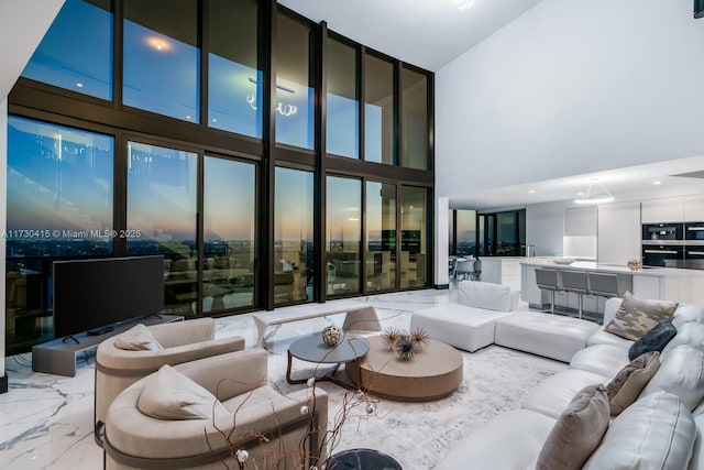 18555 Collins Ave Unit 4203, Sunny Isles Beach, FL 33160 - living room featuring a high ceiling and marble tiled flooring