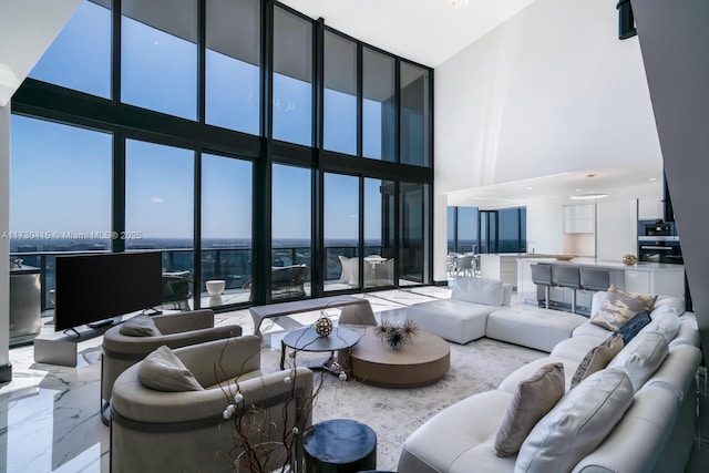 18555 Collins Ave Unit 4203, Sunny Isles Beach, FL 33160 - living room with a high ceiling and a wall of windows