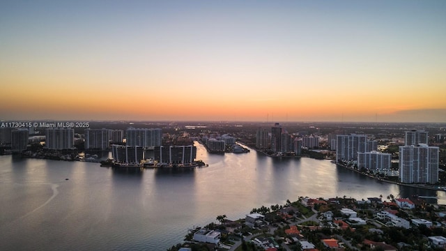 18555 Collins Ave Unit 4203, Sunny Isles Beach, FL 33160 - aerial view at dusk of a water view and a view of city