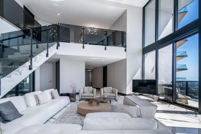 18555 Collins Ave Unit 4203, Sunny Isles Beach, FL 33160 - living area featuring a high ceiling and stairway