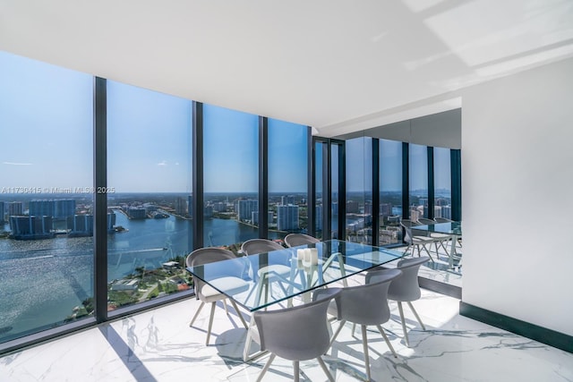 18555 Collins Ave Unit 4203, Sunny Isles Beach, FL 33160 - sunroom / solarium featuring a view of city and a water view