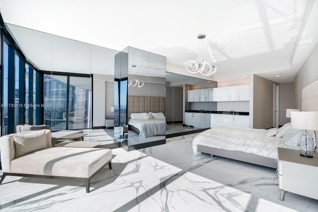 18555 Collins Ave Unit 4203, Sunny Isles Beach, FL 33160 - bedroom featuring a chandelier and light marble finish floors