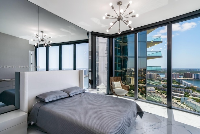 18555 Collins Ave Unit 4203, Sunny Isles Beach, FL 33160 - bedroom with a chandelier, expansive windows, multiple windows, marble tiled floors, and a view of city