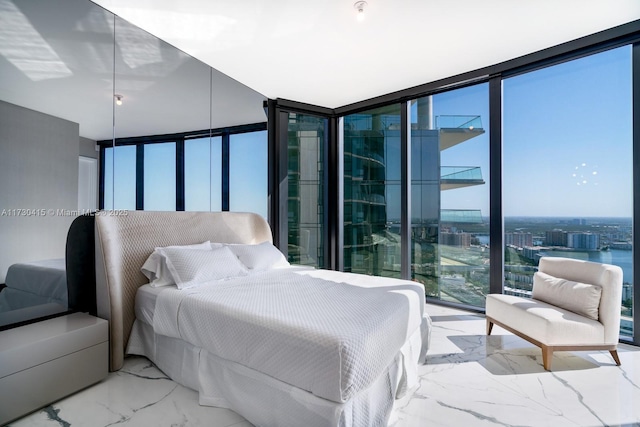 18555 Collins Ave Unit 4203, Sunny Isles Beach, FL 33160 - bedroom featuring marble finish flooring and floor to ceiling windows