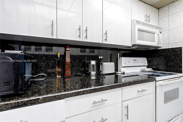 kitchen with tasteful backsplash, white appliances, dark stone counters, and white cabinets