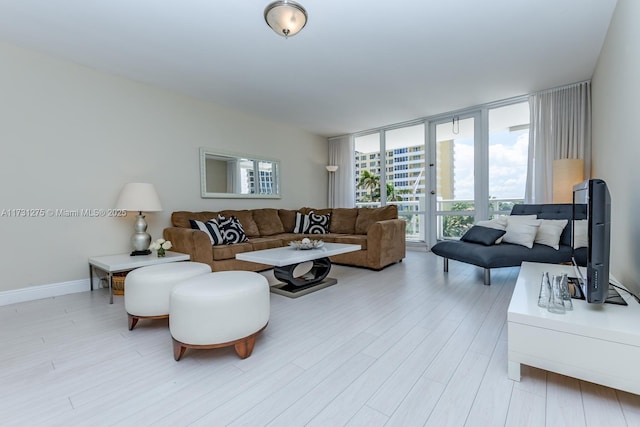 living room featuring light hardwood / wood-style floors and expansive windows