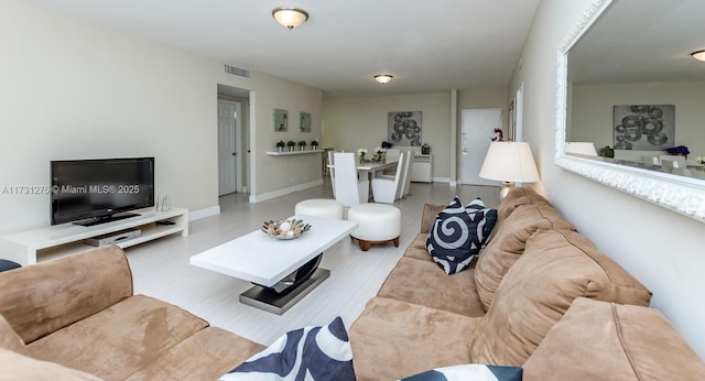 living room with light hardwood / wood-style flooring